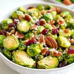 For this Dijon Brussels Sprouts Salad with Pecans, you will need: - 1 lb Brussels sprouts, trimmed and halved - 1/2 cup pecans, roughly chopped - 1/4 cup dried cranberries - 1/4 cup grated Parmesan cheese (optional) These fresh Brussels sprouts make the salad crisp and hearty. Pecans add a nice crunch, while cranberries give a sweet touch. If you like cheese, Parmesan brings a savory layer that makes everything pop. The dressing is key to tying it all together. You will want: - 1/4 cup olive oil - 3 tablespoons Dijon mustard - 2 tablespoons apple cider vinegar - 1 tablespoon honey - Salt and pepper to taste This dressing is simple yet flavorful. The Dijon mustard gives a sharp taste, while honey adds sweetness. The vinegar brightens up the salad, making every bite refreshing. Each serving of this salad provides a healthy mix of nutrients. You can expect about: - Calories: 250 - Fats: 18g - Proteins: 6g - Vitamins: High in Vitamin C and K - Minerals: Good source of magnesium and potassium This salad is not just tasty, but it also supports your health. It offers good fats from the olive oil and pecans, plus plenty of vitamins from the Brussels sprouts. Enjoy this dish knowing it's good for you! Start by trimming the ends of the Brussels sprouts. Then, slice each one in half. This helps them cook evenly. Next, preheat your oven to 400°F (200°C). This warm environment is key for roasting. Spread the halved Brussels sprouts on a baking sheet. Drizzle with olive oil for flavor. Sprinkle salt and pepper to taste. Roast them in the oven for about 20 to 25 minutes. Stir them halfway through for even cooking. You want them tender with golden edges. While the Brussels sprouts roast, let’s make the dressing. In a small bowl, combine 3 tablespoons of Dijon mustard, 2 tablespoons of apple cider vinegar, and 1 tablespoon of honey. Add salt and pepper to taste. Whisk these ingredients together until they blend well. Once the Brussels sprouts are done, take them out of the oven. In a large mixing bowl, combine the roasted Brussels sprouts, 1/2 cup of chopped pecans, and 1/4 cup of dried cranberries. Drizzle the dressing over this mixture. Gently toss everything to coat well. If you like, add 1/4 cup of grated Parmesan cheese on top before serving. To keep your Dijon Brussels sprouts salad fresh, store leftovers in an airtight container. Place it in the fridge for up to three days. If you want to keep the pecans crunchy, store them separately. Add them just before serving to keep the salad nice and crisp. You can save time by prepping parts of the salad ahead. Trim and halve the Brussels sprouts a day ahead and store them in water. This keeps them fresh. You can also make the dressing the day before. Just whisk together the Dijon mustard, apple cider vinegar, honey, salt, and pepper. Store it in the fridge until you need it. For a great look, serve the salad in a large wooden bowl. This makes it feel special. Add extra pecans and a sprinkle of Parmesan cheese on top. This adds color and texture. You can also garnish with fresh herbs like parsley for a bright touch. Enjoy a salad that not only tastes good but looks amazing too! {{image_2}} You can switch out the pecans in this salad. Try walnuts or sunflower seeds for a different crunch. If you want a sweet touch, go for raisins or chopped dates instead of cranberries. For the dressing, you can use whole grain mustard if you want a different flavor. You can also skip the honey if you prefer a dressing without added sugar. To make this salad gluten-free, use gluten-free mustard and check your vinegar. For a vegan option, just leave out the Parmesan cheese. You can also replace honey with maple syrup or agave nectar. If you need a nut-free salad, simply skip the nuts. The salad will still taste great without them! You can add seasonal veggies or fruits to this salad. In the fall, try adding sliced apples or pears for sweetness. In the spring, fresh peas or radishes add bright colors and flavors. You can also mix in roasted butternut squash in the winter. Each season brings its own tasty options for this salad! What goes well with the Dijon Brussels sprouts salad? I love to serve it with grilled chicken or roasted salmon. Both add protein and flavor. You can also pair it with quinoa or couscous for a hearty meal. If you want a lighter option, serve it with a simple soup, like tomato or butternut squash. This salad also shines as a side for holiday dinners. How much salad should you serve? For a main dish, aim for about 1.5 to 2 cups per person. If it’s a side, 1 cup is usually enough. At a party, you can serve smaller portions, around ½ cup. This way, guests can try multiple dishes without feeling too full. Want to boost the taste even more? Consider adding sliced apples or pears. They bring a nice crunch and sweetness. You could also sprinkle some feta cheese for a salty kick. If you like spicy, add a pinch of red pepper flakes. For dressings, a lemon vinaigrette works well too. It brightens the salad and balances the Dijon flavor. You can prep this salad a day in advance. Start by roasting the Brussels sprouts. Let them cool. Store them in the fridge in an airtight container. Make the dressing too and keep it separate. When you’re ready to eat, mix everything in a bowl. This keeps the salad fresh and crisp. Yes, fresh Brussels sprouts are better. They have more flavor and a nice crunch. Fresh sprouts also retain more nutrients. They are easy to trim and halve. Frozen sprouts may be mushy after cooking. Use fresh for a better salad experience. Store leftovers in an airtight container. Keep them in the fridge for up to three days. If you added cheese, eat it sooner. The dressing can separate, so mix well before eating. This keeps your salad tasty and fresh for later. This post covered a tasty Brussels sprouts salad. You learned about key ingredients, dressing, and nutrition. I shared step-by-step instructions for preparing and roasting the sprouts. You also found tips on storage and meal prep, along with ideas for adding variety. Finally, I highlighted how to serve it alongside other dishes. Enjoy making this salad! It’s healthy and easy to customize. You now have the tools to create a dish that impresses and satisfies. Happy cooking!