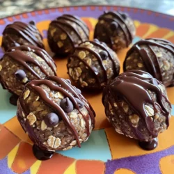 - 1 cup rolled oats - 1/2 cup natural peanut butter - 1/4 cup honey or maple syrup - 1/4 cup chocolate protein powder - 1/4 cup mini chocolate chips - 1/4 cup ground flaxseeds (optional) - 1/2 teaspoon vanilla extract - A pinch of salt These ingredients create a tasty and nutritious snack. The rolled oats give a chewy texture, while the peanut butter adds healthy fats. Honey or maple syrup acts as a natural sweetener. Chocolate protein powder boosts the protein content, making these balls a great post-workout treat. Mini chocolate chips add a fun touch, making them feel more like a dessert. Ground flaxseeds provide extra fiber and omega-3 fatty acids, though they are optional. Each protein ball contains about 4-5 grams of protein. This makes them a good choice for a quick energy boost. The oats provide around 15 calories each, while peanut butter adds healthy fats. Honey contributes sweetness and some calories as well. For serving size, you can expect about 12 to 15 balls from this recipe. This makes it easy to share or enjoy throughout the week. Storing them in the fridge helps keep them fresh and tasty for up to a week. To make these chocolate peanut butter protein balls, start by mixing your ingredients in a bowl. Gather a large mixing bowl. In it, combine: - 1 cup rolled oats - 1/2 cup natural peanut butter - 1/4 cup honey or maple syrup - 1/4 cup chocolate protein powder - 1/2 teaspoon vanilla extract - A pinch of salt Stir these ingredients well until they blend into a dough-like consistency. If the mix seems too crumbly, simply add a bit more peanut butter. This helps bind the ingredients together. Next, you’ll shape your protein balls. Use your hands to scoop about a tablespoon of the mixture. Roll it into a ball. Repeat this step until you finish the mixture. Place the protein balls on a baking sheet lined with parchment paper. Refrigerating is key for firmness. Chill the balls for at least 30 minutes. This helps them hold their shape when you enjoy them later. For an attractive serving, arrange the protein balls on a colorful plate. You can drizzle some melted dark chocolate over the top for a fun touch. This not only adds flair but also enhances the flavor. Enjoy your tasty and healthy treat! To get the right texture, adjust the peanut butter amount. If the mix feels dry, add more peanut butter. This will help bind the ingredients well. If the mix seems too wet, add more oats. This will soak up excess moisture and help the balls hold shape. Get creative with add-ins to boost flavor. Try adding nuts or seeds for crunch. You can also use different protein powders. Each type has a unique taste, so choose one you love. This makes the protein balls even more enjoyable. These protein balls pair well with fruits or yogurt. Fresh fruits add a nice touch and balance the flavors. They also make a great post-workout snack. Just grab one for a quick energy boost. Enjoy them anytime you need a tasty treat! {{image_2}} You can easily change the flavor of your protein balls. One great option is to swap almond butter for peanut butter. Almond butter adds a nutty taste that many people love. It can also lighten the flavor while still keeping it creamy. Another fun idea is to add cocoa powder. This makes your protein balls richer in chocolate flavor. Just mix in a couple of tablespoons when you combine the ingredients. Your taste buds will thank you! Making your protein balls vegan is simple. You can use maple syrup instead of honey. This keeps the sweet taste while making it plant-based. If you want to make it gluten-free, choose certified gluten-free oats. This ensures everyone can enjoy your tasty treats! Get creative by adding seasonal flavors! For fall, try mixing in pumpkin spice. It gives a warm, cozy taste that’s perfect for the season. You can also make festive versions for holidays. Think about adding peppermint extract for winter or colorful sprinkles for birthdays. These fun twists keep your protein balls exciting all year long! To keep your protein balls fresh, store them in the fridge. Place them in an airtight container. This will help keep moisture in and prevent drying out. You can also use a zip-top bag. Just make sure to remove as much air as possible. If they feel a bit dry, add a touch more peanut butter next time. This helps them stay moist and delicious. If you want to save your protein balls for later, freezing is a great option. First, place them in a single layer on a baking sheet. Freeze them for about an hour. After that, transfer the balls to a freezer-safe bag or container. They can last for up to three months in the freezer. When you’re ready to eat them, just take out a few. Let them thaw in the fridge for a few hours or at room temperature for about 30 minutes. The best containers for keeping your protein balls fresh are glass or BPA-free plastic. Glass containers are great because they don't absorb odors. Label your containers with the date you made them. This helps you keep track of how long they’ve been stored. You can also write down any special notes, like flavor variations you tried. This way, you’ll stay organized and always know what you have on hand! To make these protein balls vegan, simply swap honey with maple syrup. Maple syrup gives sweetness and works well in this recipe. You can also check that your protein powder is plant-based. Some brands offer vegan options that are free from dairy. This way, you still get the protein boost without using animal products. These tasty treats last about a week in the fridge. Store them in an airtight container to keep them fresh. If you want to keep them longer, freeze them. They can last up to three months in the freezer. Just let them thaw in the fridge before enjoying them again. Absolutely! You can mix in nuts, seeds, or dried fruits. If you have allergies, try sunflower seed butter instead of peanut butter. You can also switch the mini chocolate chips for dark chocolate chunks for a richer flavor. The choices are endless, so have fun and make them your own! These chocolate peanut butter protein balls are easy to make and tasty. We covered the key ingredients and their nutritional benefits. I shared step-by-step instructions and helpful tips for perfecting these snacks. You can also explore different flavors and storage options to keep them fresh. Enjoy making your own protein balls. They fit well into many diets and are great for any time of the day. Remember to experiment and customize them to your liking!