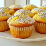 To make Bakery Style Lemon Poppy Seed Muffins, you need fresh, quality ingredients. Here’s what you should gather: - 2 cups all-purpose flour - 1 tablespoon baking powder - 1/2 teaspoon baking soda - 1/2 teaspoon salt - 1 cup granulated sugar - 1/2 cup unsalted butter, softened - 2 large eggs - 1 cup buttermilk or milk with vinegar - Zest of 2 lemons - 1/4 cup fresh lemon juice - 1/4 cup poppy seeds - Optional: powdered sugar for dusting Each ingredient plays a key role in the flavor and texture of the muffins. The flour gives structure, while the baking powder and baking soda help them rise. The sugar adds sweetness, and the butter keeps them moist. Eggs bind everything together. Lemon zest and juice provide a bright, fresh flavor, while poppy seeds add a nice crunch. If you want a sweeter touch, a dusting of powdered sugar can enhance the look. Gather these items, and prepare to bake something delightful! - Preheat your oven to 375°F (190°C). - Prepare your muffin tin with liners or coat it with cooking spray. - In a medium bowl, whisk together 2 cups of all-purpose flour. - Add 1 tablespoon of baking powder, 1/2 teaspoon of baking soda, and 1/2 teaspoon of salt. - In a large bowl, cream 1/2 cup of softened unsalted butter with 1 cup of granulated sugar. - Mix until the mixture is light and fluffy, which takes about 3-4 minutes. - Add 2 large eggs to the butter mixture, one at a time. - Mix well after each addition. Then, add the zest of 2 lemons and 1/4 cup of fresh lemon juice. - Gradually add the dry ingredients to the butter mixture. - Alternate this with 1 cup of buttermilk. Start and finish with the dry mix. - Mix just until combined to avoid overmixing. - Gently fold in 1/4 cup of poppy seeds until they are evenly spread. - Divide the batter into the prepared muffin tin, filling each cup about 3/4 full. - Bake for 18-20 minutes. A toothpick should come out clean when done. - Let the muffins cool in the tin for 5 minutes, then move them to a wire rack. To get the best texture in your muffins, avoid overmixing the batter. Overmixing makes muffins dense and tough. Mix just until the dry ingredients blend with the wet ones. Use fresh ingredients for the best flavor. Fresh lemons and good butter can make a big difference in taste. For fluffy muffins, cream the butter and sugar thoroughly. This step adds air to your batter. It helps the muffins rise well during baking. Make sure your buttermilk is at room temperature. Cold buttermilk can cause the batter to cool down too much, affecting the rise. For a lovely finish, consider a dusting of powdered sugar. It adds sweetness and looks nice on top. This simple step can elevate your muffins from good to great. You can also serve them with lemon zest sprinkles for a pop of color. {{image_2}} Adding blueberries gives these muffins a fruity twist. The sweet burst from the berries pairs well with the tart lemon. I suggest folding in about one cup of fresh or frozen blueberries after mixing the batter. This adds color and flavor. You can enjoy a delightful surprise in every bite! Another option is to incorporate almond extract. Just one teaspoon can elevate the taste. It adds a nutty depth that blends beautifully with lemon. I love how it enhances the overall flavor profile. It’s a simple way to make the muffins even more special. For those needing gluten-free options, you can swap all-purpose flour with a gluten-free flour blend. Look for a blend that contains xanthan gum. This helps maintain the texture you want in your muffins. Just use the same amount of gluten-free flour as regular flour. If you want a vegan version, replace the eggs with flax eggs. To make one flax egg, mix one tablespoon of ground flaxseed with three tablespoons of water. Let it sit for a few minutes until it thickens. This will help bind your muffins without using eggs. You can also use a dairy-free milk to replace buttermilk. Almond or oat milk works well in this case. Store your lemon poppy seed muffins in an airtight container. This keeps them fresh. Place them at room temperature for up to three days. If you want to keep them longer, use the fridge. Just know that the muffins may dry out a bit. For long-term storage, freeze your muffins. First, let them cool completely. Wrap each muffin in plastic wrap. Then, place them in a freezer bag. Make sure to remove any air before sealing. This keeps out freezer burn. You can freeze them for up to three months. To enjoy your muffins warm again, preheat your oven to 350°F (175°C). Place the muffins on a baking sheet. Heat them for about 10-15 minutes. You can also use a microwave. Heat each muffin for about 15-20 seconds. Enjoy them fresh and warm! Yes, you can use regular milk. Just add 1 tablespoon of vinegar to it. Let it sit for 5-10 minutes. This will mimic buttermilk's tangy flavor. You can also use yogurt or sour cream mixed with water as another option. These muffins last about 3-4 days at room temperature. Store them in an airtight container. For longer storage, keep them in the fridge for up to a week. If you want to keep them longer, freeze them for up to 3 months. If poppy seeds are not available, try using sesame seeds. They add a nice crunch and flavor. You can also leave them out entirely for a lemon muffin. Another option is to use chia seeds, which also provide some texture. Yes, you can double the recipe easily. Just double each ingredient and mix in a large bowl. Use two muffin tins for baking. Keep an eye on the baking time, as it might change slightly. Always check with a toothpick to ensure they are baked through. This blog post covered how to make tasty lemon poppy seed muffins. You learned about the needed ingredients, from flour to lemon juice. I explained step-by-step instructions, with tips for perfect texture. You can explore variations like adding blueberries and storing easily. Baking takes practice, but it’s worth the effort. Enjoy your muffins fresh or frozen, and share them with friends! Happy baking!