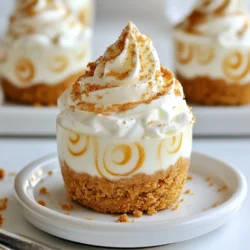 - 1 cup gingerbread cookie crumbs - 2 tablespoons melted butter - 1 cup cream cheese, softened - 1/2 cup powdered sugar - 1 teaspoon vanilla extract - 1 teaspoon ground ginger - 1 teaspoon ground cinnamon - 1/4 teaspoon ground cloves - 1 cup heavy whipping cream - Whipped cream for topping - Additional gingerbread cookie crumbs for garnish Gathering the right ingredients is key to a great no-bake gingerbread cheesecake cup. The main ingredients include gingerbread cookie crumbs, melted butter, cream cheese, and powdered sugar. These create a smooth and creamy base for your dessert. To add warmth and depth, we use spices and flavorings. Vanilla extract, ground ginger, ground cinnamon, and ground cloves enhance the taste. Each spice plays a unique role in making the dessert festive and delicious. For the topping, heavy whipping cream is essential. Whipping it adds lightness to your cheesecake mix. Finally, use whipped cream and more gingerbread cookie crumbs to finish the cups. These toppings will give your dessert a lovely look and extra flavor. Now, you're ready to make these delightful treats! {{ingredient_image_1}} To start, gather your gingerbread cookie crumbs and melted butter. In a mixing bowl, combine the gingerbread crumbs with the melted butter. Mix well until the crumbs are fully coated. Next, press this mixture evenly into the bottom of your serving cups. Make sure it is compact to form a sturdy crust. In another bowl, beat the softened cream cheese until it is smooth. This step is key for a creamy texture. Gradually add the powdered sugar, mixing until it blends well. Now, add the vanilla extract, ground ginger, ground cinnamon, and ground cloves. Continue mixing until all the spices are evenly combined. In a clean bowl, whip the heavy cream until stiff peaks form. This process gives your dessert a light and airy texture. Now, gently fold the whipped cream into the cream cheese mixture. Be careful not to deflate it! Once mixed, layer the cream cheese filling over the gingerbread crusts in the cups. Fill each cup about three-quarters full. Now it’s time to chill! Place the cheesecake cups in the refrigerator. Let them chill for at least 4 hours, or until they set. This step helps the flavors meld and the filling firm up. Before serving, add a generous dollop of whipped cream on top. For a final touch, sprinkle additional gingerbread cookie crumbs for extra flavor and texture. To get the best texture for your cheesecake cups, start by whipping the cream. Use a chilled bowl and beaters. This helps the cream whip faster. Whip until you see stiff peaks form. This step adds air and lightness to your dessert. Next, when you mix the cream cheese, ensure it is softened. Beat it until smooth and creamy. If it feels lumpy, it will affect your final dessert. Gradually add the powdered sugar. This helps blend it evenly without lumps. To boost flavor, consider adding a pinch of nutmeg or allspice. These spices blend well with ginger and cinnamon. You can also try a splash of maple syrup for extra sweetness. For pairing, think about serving these cups with coffee or chai. The warm spices in the drinks complement the cheesecake flavors. You can even serve them with a slice of fruit tart for a fun dessert trio. Serving the cheesecake cups can be fun and creative. Use clear cups or glasses to show off the layers. You can even use small mason jars for a rustic look. For festive touches, add sprigs of mint or cinnamon sticks on top. Crushed candy canes can also add a holiday flair. Just be sure to keep it simple to let the dessert shine! Pro Tips Chill Your Bowls: Before whipping the cream, chill your mixing bowl and beaters in the freezer for about 10 minutes. This will help the cream whip up faster and achieve better volume. Spice It Up: Feel free to adjust the spices according to your taste. Add more ginger for a spicier kick or a bit of nutmeg for additional warmth. Make Ahead: These cheesecake cups can be made a day in advance. Just keep them covered in the refrigerator until ready to serve. Garnish Ideas: Experiment with different toppings! Crushed peppermint, chocolate shavings, or a drizzle of caramel can add a unique twist to your cheesecake cups. {{image_2}} You can switch up the crust by using different cookies. Try chocolate cookies for a rich taste or vanilla cookies for a lighter flavor. Each option brings a new twist to the dessert. Different spice mixes can also change the flavor. Add nutmeg for warmth or cardamom for a unique touch. Each spice adds a new layer of taste to your cheesecake. To make this dessert gluten-free, use gluten-free gingerbread cookies. They work just as well as regular ones. For a dairy-free option, swap cream cheese for a dairy-free version made from nuts or tofu. Instead of heavy cream, use coconut cream for a rich and creamy texture. This will keep your cheesecake light while meeting dietary needs. You can easily adjust this recipe for more or fewer servings. If you need more, just double the ingredients. For smaller gatherings, reduce the amounts by half. Mini versions are fun for parties. Use small cups or shot glasses to serve individual portions. For a family-sized treat, layer the cheesecake in a larger dish instead of cups. To keep your no-bake gingerbread cheesecake cups fresh, store them in the fridge. Use an airtight container to prevent any odors from other foods. These cups stay good for about 3 to 5 days in the fridge. If you want to freeze them, wrap each cup tightly in plastic wrap. They can last up to 3 months in the freezer. Just remember, the texture may change a bit after freezing. If you make a larger batch, you can still enjoy them later. Just take them out of the freezer, and let them thaw in the fridge overnight. This keeps them creamy. Before serving, you can refresh the dessert by adding fresh whipped cream on top. A sprinkle of more gingerbread crumbs can make them look fresh and tasty again. It's important to check if your cheesecake cups are still good. Look for any changes in color or texture. If you see any mold or an off smell, it's best to throw them away. Store your cups in clear containers to see what's inside easily. Keeping them organized can help you avoid any surprises! Yes, you can make these cheesecake cups ahead of time. I recommend preparing them the day before you plan to serve them. Just store them in the fridge. They will stay fresh for about three days. Cover each cup with plastic wrap to keep them nice. This way, the flavors will meld together, making them even tastier! If you don't have gingerbread cookies, you have options! You can use other types of cookies for the crust. Try using graham crackers or vanilla wafers. Chocolate cookies can also work well for a fun twist. Just crush them up and mix with melted butter. The key is to choose a cookie with a similar texture. Serving these cheesecake cups is fun and easy. Top each cup with a generous dollop of whipped cream. This adds a nice touch. You can also sprinkle some extra gingerbread cookie crumbs on top. For a festive look, add a slice of candied ginger or a small piece of gingerbread. Place them on a pretty platter for a lovely display. These cheesecake cups combine tasty gingerbread with rich cream cheese for a great treat. You learned how to make the crust and filling step by step. Adding whipped cream and spices makes them even better. Experimenting with flavors or different cookies gives you more options. Always store them well to keep them fresh. Enjoy making these delightful desserts for any occasion!