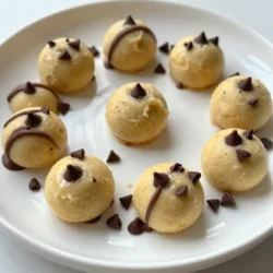 When making edible cookie dough bites, you need a few simple ingredients. These ingredients create a rich and tasty treat that everyone will love. Here’s the complete list of what you’ll need: - 1 cup all-purpose flour (heat-treated) - ½ cup unsalted butter, softened - ½ cup brown sugar - ¼ cup granulated sugar - 1 teaspoon vanilla extract - 2 tablespoons milk - ½ cup mini chocolate chips - Pinch of salt Each ingredient plays a key role. The flour gives structure, while the butter adds creaminess. The sugars sweeten the dough and create that classic cookie flavor. Vanilla adds warmth, and milk keeps it soft. Mini chocolate chips? They provide delightful bursts of chocolate in every bite. Heat-treating the flour is important. This step kills any harmful bacteria and makes the dough safe to eat. You bake it for just a few minutes to achieve this. With these ingredients, you can make a treat that is fun and safe to eat. So gather everything, and let’s get started! {{ingredient_image_1}} First, preheat your oven to 350°F (175°C). This step is key for safety. Spread 1 cup of all-purpose flour on a baking sheet. Bake the flour for 5 to 7 minutes. This process heat-treats the flour, making it safe to eat raw. After baking, let the flour cool completely before using it in your dough. This cooling step is important for the right texture. Next, grab a mixing bowl. Combine ½ cup of softened unsalted butter, ½ cup of brown sugar, and ¼ cup of granulated sugar in the bowl. Use a hand mixer or stand mixer to beat these together until they are creamy. This mixing adds air and makes your dough light. Then, add 1 teaspoon of vanilla extract and 2 tablespoons of milk. Mix until everything is fully blended. Now it’s time for the flour. Gradually add the cooled, heat-treated flour and a pinch of salt to your creamy mixture. Stir until it becomes a cookie dough consistency. After that, fold in ½ cup of mini chocolate chips. Make sure they are evenly mixed throughout the dough. To form the bites, scoop out tablespoon-sized portions of the dough. Roll them into small balls with your hands. Place these balls on a baking sheet lined with parchment paper. Finally, chill the cookie dough bites in the fridge for at least 30 minutes. This chilling step helps them firm up and makes them easier to eat. To get the best texture, heat-treat the flour. This step kills any harmful bacteria. Spread the flour on a baking sheet. Preheat your oven to 350°F and bake it for 5 to 7 minutes. Let it cool completely before using. This will ensure your cookie dough bites are safe and tasty. Next, cream the butter and sugars correctly. Use softened unsalted butter for a smooth mix. Combine it with brown and granulated sugars in a bowl. Beat them together until the mixture is creamy. This step adds air, giving your bites a lighter texture. Great presentation makes your bites look even more delicious. Arrange the chilled cookie dough bites on a decorative plate. You can use colorful plates to add flair. Sprinkle a few extra chocolate chips around them for a fun touch. Drizzling melted chocolate over the bites adds a special treat. Melt some chocolate in the microwave, then use a spoon to drizzle it. This simple step makes your treats look fancy and inviting. Avoid not chilling the dough enough. Chilling firms up the dough and makes rolling easier. If the dough is too soft, it may spread too much. Overmixing the ingredients is another mistake to watch out for. When adding flour, mix just until combined. Overmixing can make the bites tough instead of soft and chewy. Stick to gentle mixing for the best results. Pro Tips Heat-Treat Your Flour: This step is crucial to eliminate any harmful bacteria in raw flour, ensuring your cookie dough bites are safe to eat. Use Softened Butter: Make sure your butter is at room temperature for easy mixing, which will yield a creamier texture in your dough. Chill for Firmness: Chilling the dough not only helps the bites hold their shape but also enhances the flavors as they meld together. Experiment with Mix-Ins: Feel free to customize your cookie dough bites by adding nuts, dried fruits, or different types of chocolate chips for variety. {{image_2}} You can easily change the flavors of your edible cookie dough bites. One fun option is to make peanut butter cookie dough bites. Just swap half the butter for creamy peanut butter. Mix it in with the sugars. This adds a rich, nutty taste that many people love. Another great choice is funfetti cookie dough bites. Add colorful sprinkles into the mix. They add a joyful look and a little crunch. This makes the bites perfect for parties or special occasions. You can also switch up your add-ins. Instead of mini chocolate chips, consider using chopped nuts or dried fruits. Walnuts, pecans, or even dried cranberries can add a nice twist. These substitutions keep your bites exciting and unique. If you need a gluten-free option, use gluten-free flour instead of all-purpose flour. There are many great brands available. Making this switch keeps the flavor and texture just as good. Edible cookie dough bites are tasty on their own, but you can elevate them. Pair them with a scoop of ice cream or yogurt for a sweet treat. The creamy texture of ice cream complements the bites well. Another fun way to enjoy them is to use them as toppings for desserts. Sprinkle them over brownies or cakes. This adds a delicious layer of flavor and fun to your favorite sweets. To keep your edible cookie dough bites fresh, store them properly. You can choose to keep them in the refrigerator or freezer. - Refrigerator: Place the dough bites in an airtight container. This will help keep them fresh for a shorter time. - Freezer: For longer storage, use an airtight container or a freezer bag. This prevents freezer burn and keeps them tasty. How long do these bites last? - In the fridge: They stay good for about one week. - In the freezer: You can enjoy them for up to three months. Just remember to thaw them in the fridge before eating. Want to share the joy? Here are fun packaging ideas: - Use small jars or clear bags to show off the bites. - Tie them with colorful ribbon for a pretty touch. - Add a cute note or label with the date you made them. These tips make your edible cookie dough bites delightful gifts! Yes, edible cookie dough is safe to eat when you use heat-treated flour. Heat-treating flour kills harmful bacteria that can cause illness. To heat-treat flour, spread it on a baking sheet and bake it at 350°F for 5-7 minutes. Let it cool completely before mixing it into your dough. This step is key to enjoying raw cookie dough safely. No, I do not recommend using regular flour. Regular flour may contain harmful bacteria. Eating raw flour can lead to foodborne illness. Always use heat-treated flour for safety. This way, you can enjoy your cookie dough bites without worry. You can easily make these cookie dough bites vegan! Here are some simple swaps: - Use ½ cup of coconut oil instead of unsalted butter. - Replace milk with almond milk or any plant-based milk. - Use a vegan brown sugar and granulated sugar if needed. These changes keep the taste and texture delicious while making them vegan-friendly! You now have a complete guide to making delicious edible cookie dough bites. We covered the key ingredients, detailed steps, helpful tips, and fun variations. Remember to heat-treat your flour to keep everything safe and tasty. Chilling the dough helps form perfect bites. Experimenting with flavors and add-ins can make your treats even better. Store them correctly, and they will last longer. Enjoy your tasty creation and share it with friends! You’ll impress everyone with these simple yet delightful cookie dough bites.